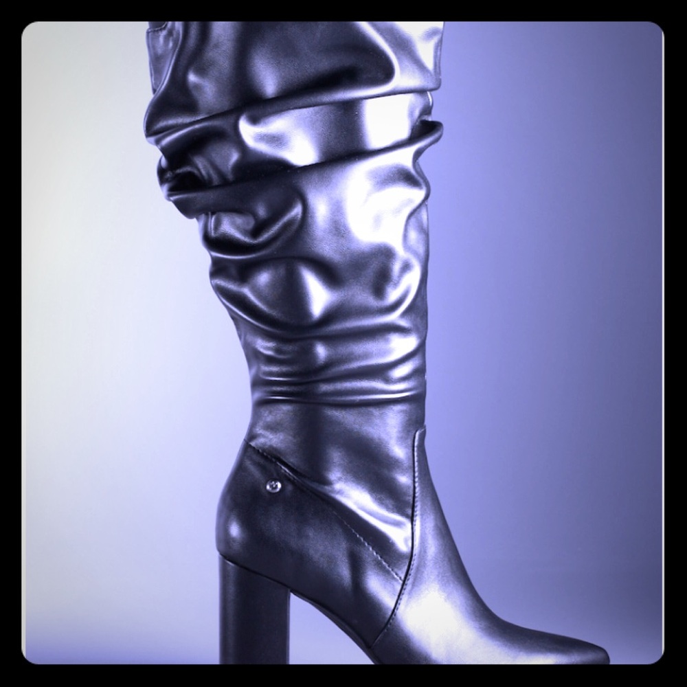 High fashion look, women’s knee high black boots.